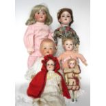 Six German bisque head dolls, including an A.M 390 with brown glass eyes, lashes, open mouth with