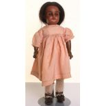 Simon & Halbig 1039 mulatto bisque head doll, With fixed brown glass eyes, open mouth, upper