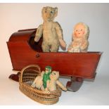 Steiff Teddy bear, circa 1909, soft toys and cradle, the straw filled blonde mohair bear with
