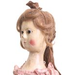 Early George II carved and painted wooden doll, English circa 1760, the gesso covered elongated face