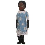 An unusual American Beecher- type black cloth doll, the stockinette face with black boot button