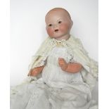 A.M 351 bisque head dream baby doll, with weighted brown glass eyes, open mouth, two teeth,