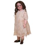 Large Tete Jumeau, size 14, German for French market, circa 1900, with weighted brown glass eyes,