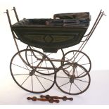 A Victorian Dolls pram, the black carriage with green lining decoration, sprung chassis with