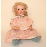 A.M 327 bisque head baby, German circa 1910, With weighted brown glass eyes, open mouth and blonde