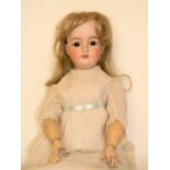 A.M 390 bisque head doll, German circa 1910, with fixed brown glass eyes, open mouth, upper teeth