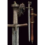 A kaskara dating: late 19th Centuryprovenance: North AfricaWide, straight, double-edged blade,