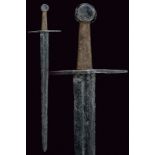 A sword dating: 14th Centuryprovenance: GermanyStraight blade with two edges converging toward the