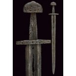 A sword dating: 11th Centuryprovenance: Northern EuropeWide, straight blade with two parallel edges,