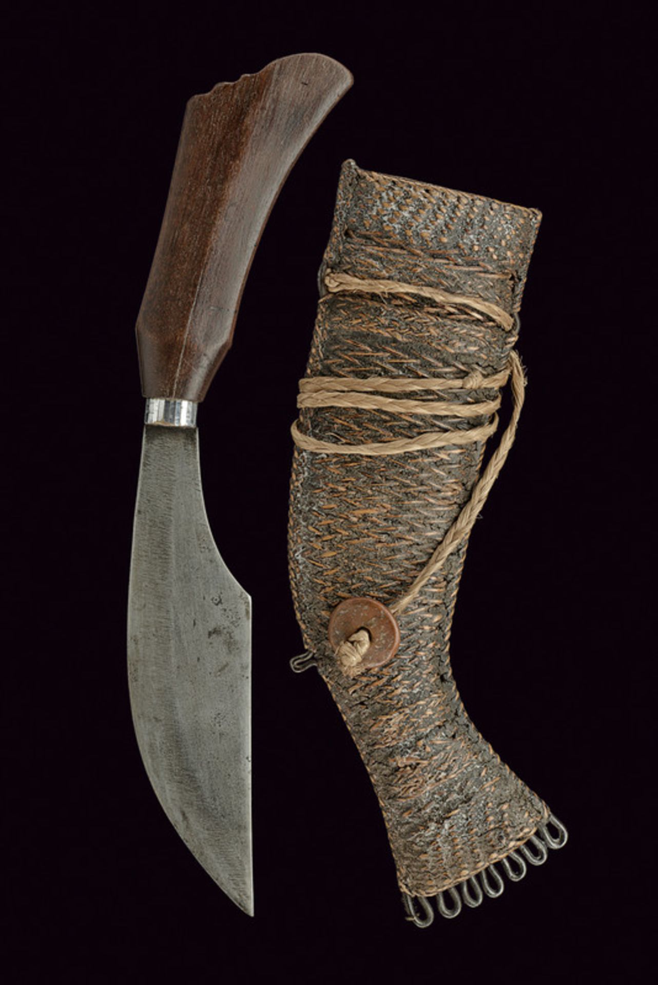 A Bagobo knife dating: circa 1900 provenance: The Philippines Wide, single-edged, iron blade; wooden - Image 3 of 3