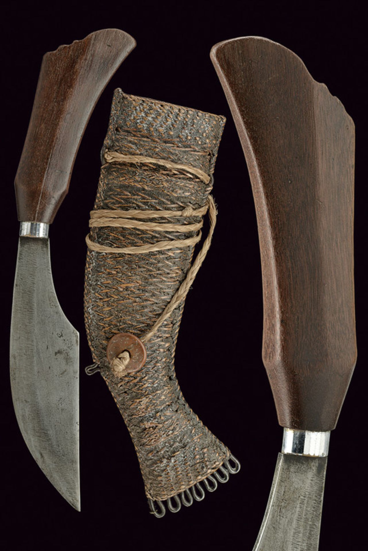 A Bagobo knife dating: circa 1900 provenance: The Philippines Wide, single-edged, iron blade; wooden