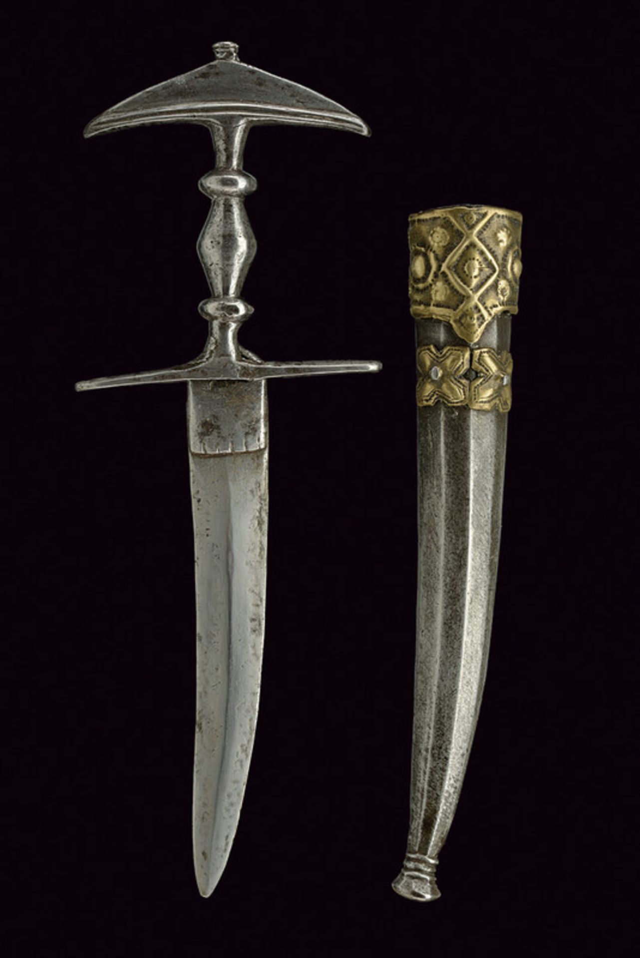 A jamadhar katari dating: 19th Century provenance: Afghanistan Curved, double-edged blade riveted at