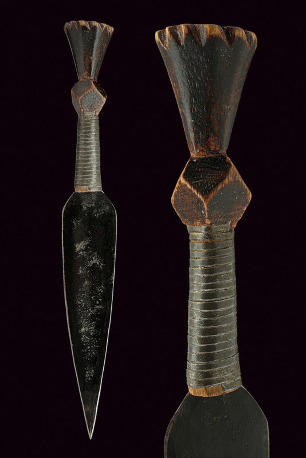 A small dagger dating: circa 1900 provenance: Africa Flat, double-edged blade; sculpted, wooden