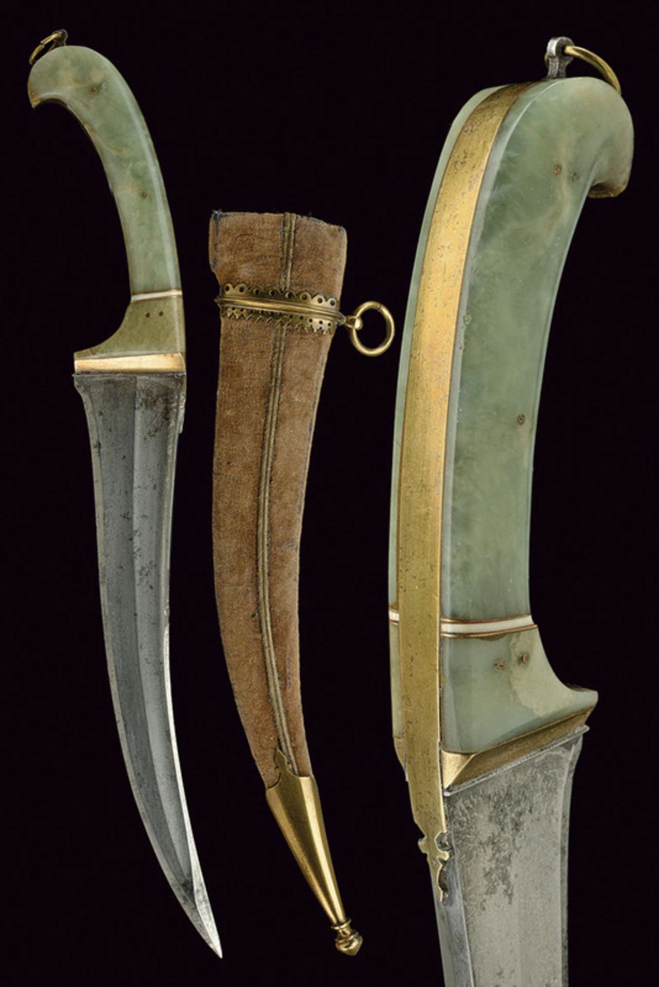 A dagger dating: 19th Century provenance: India Curved, single -and false-edged blade, with "T"-back