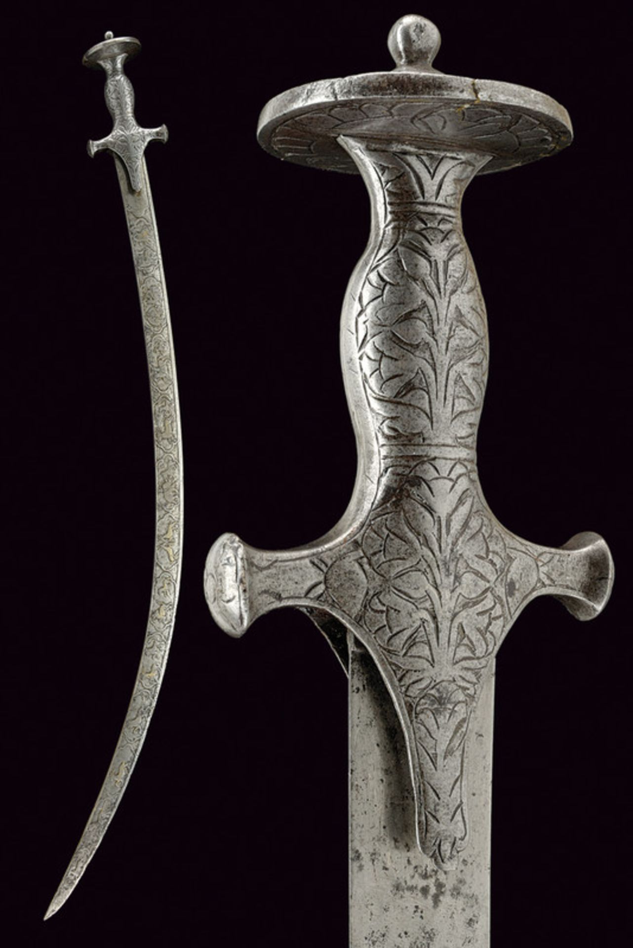 A tulvar with decorated blade dating: 19th Century provenance: India Curved, single-edged blade, one