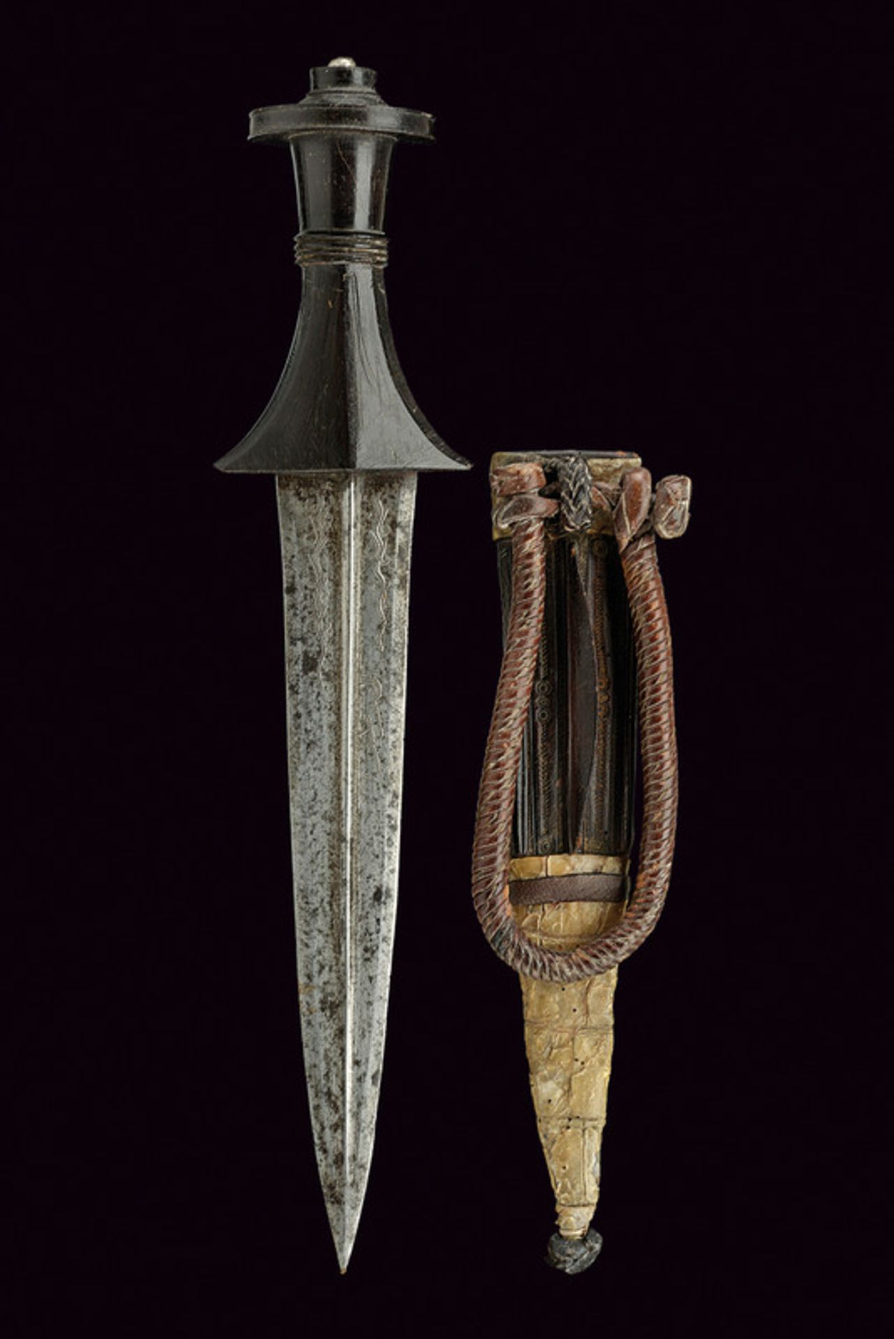 An arm dagger dating: circa 1900 provenance: Sudan Straight, double-edged blade with central raiser,