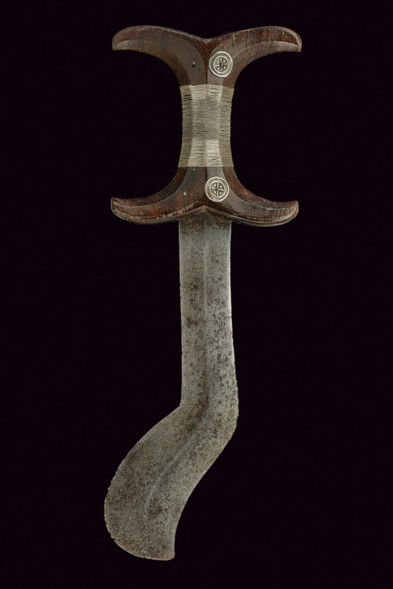 A Beja dagger dating: circa 1900 provenance: Egitto Straight, double-edged blade with curved tip and