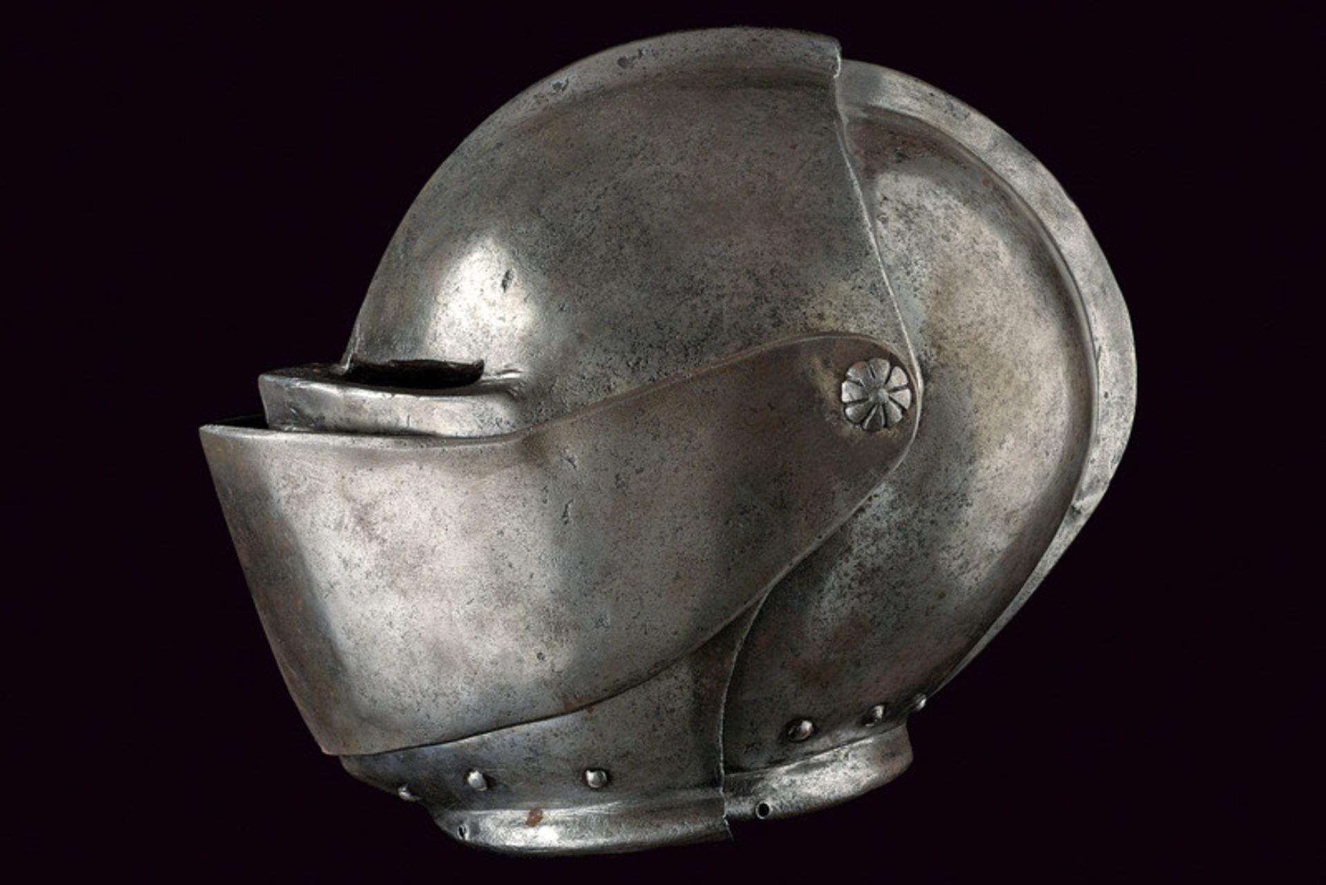 A closed helmet dating: third quarter of the 16th Century provenance: Italy Skull worked in one - Image 5 of 5