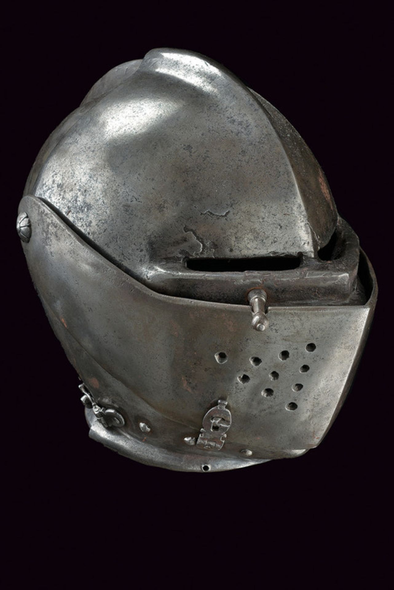 A closed helmet dating: third quarter of the 16th Century provenance: Italy Skull worked in one