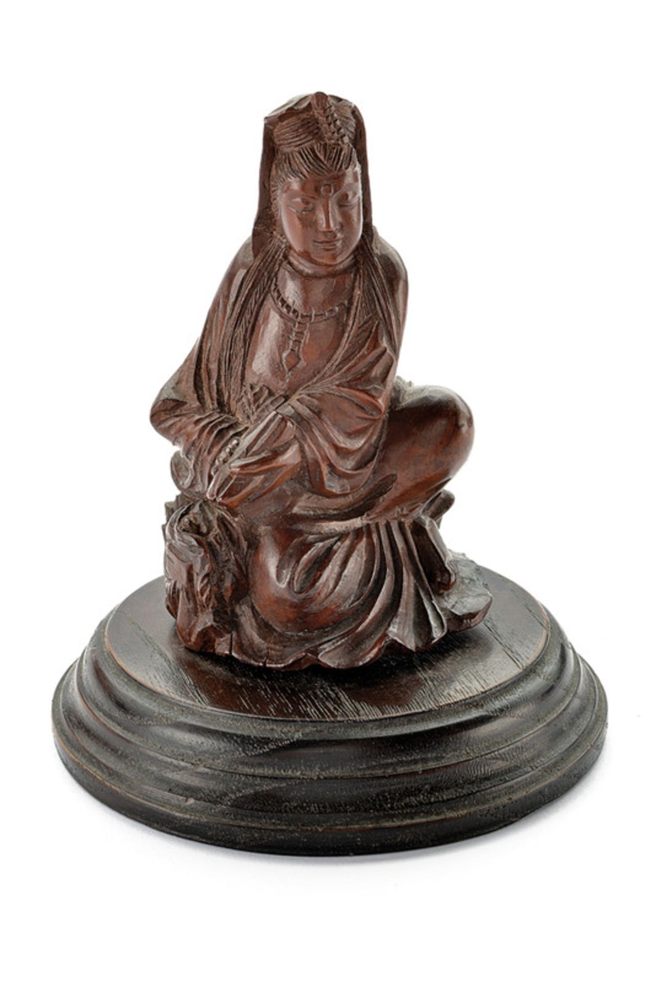 A wooden depiction of Guanyin dating: circa 1900 provenance: China Fine depiction of brown wood.