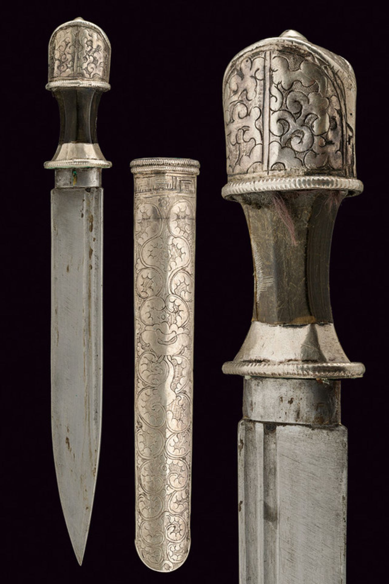 A silver mounted dagger dating: 19th Century provenance: Tibet Straight, single-edged blade with