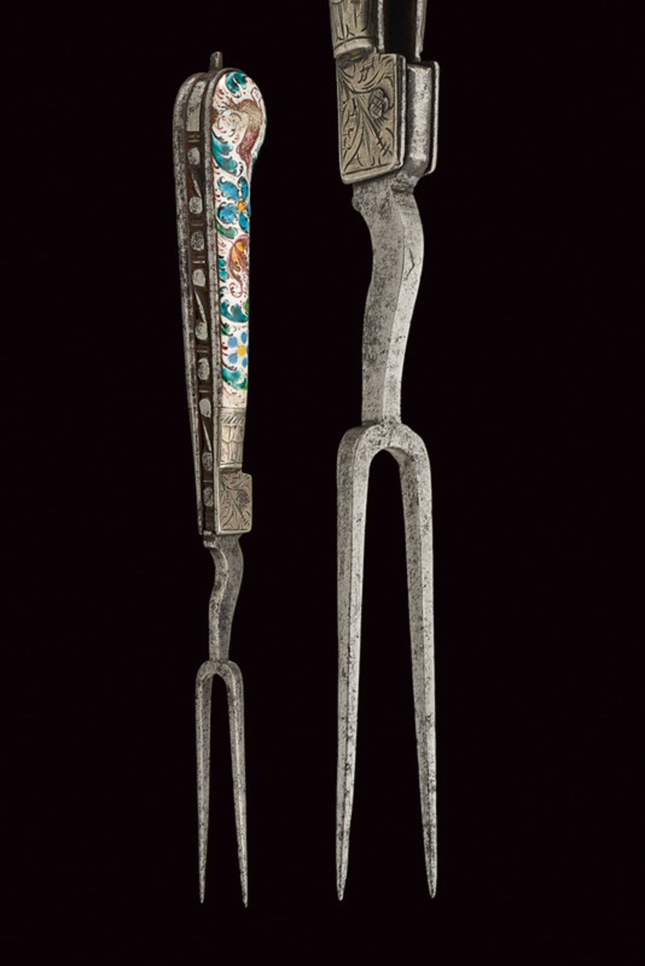 An enamelled folding fork dating: 18th Century provenance: Germany With two iron prongs; iron grip