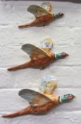 A set of three Beswick flying pheasants