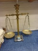 Brass balance scale on a marble base