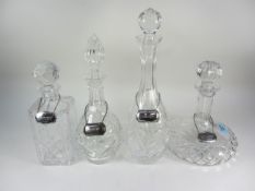 Four cut crystal decanters each with a h