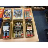 Three battery operated Japanese robots -