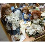 Three bisque headed costume dolls