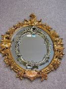 Large mirror in ornate gilt frame 105cm