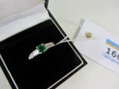 Emerald and diamond channel set platinum
