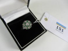 Emerald and diamond flower set ring hall