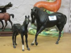 Two Royal Doulton matt black horse and f