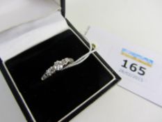 Three stone diamond ring stamped 18ct