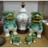 Two pairs of ceramic Chinese dogs of foe