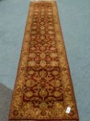 Persian design red ground runner rug, 36