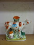 Victorian Staffordshire group of a cow a