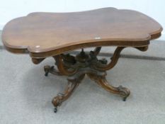 Victorian walnut dining table with shape
