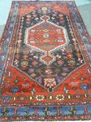 Persian Hamadan red ground rug, 242cm x