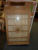 Pine display cabinet bearing plaque 'Wil