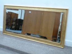 Large bevelled edge wall mirror in gilt