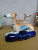 Pair Staffordshire pen holders modelled as recumbent greyhounds