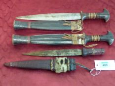 Three African knives with decorated leather sheaths 35cm and 31cm overall