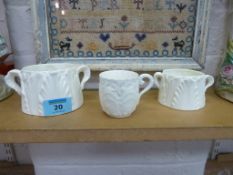 Two small Worcester twin handled cups and a similar Coalport cup