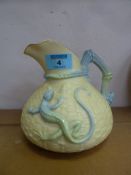 A Royal Worcester 'Lizard' jug, moulded with a pale blue and green lizard on a basket weave ground