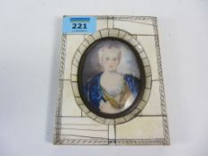 Late 19th/early20th century oval portrait miniature of a lady with jeweled hair in a blue cape