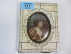 Late 19th/early20th century oval portrait miniature of a lady with spaniel signed 8cm