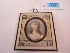 Late 19th/early20th century oval portrait miniature of a lady in light brown dress 6cm